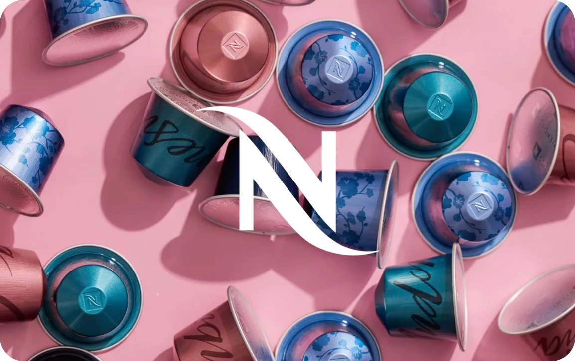 Розовый подарочный сертификат Nespresso.press